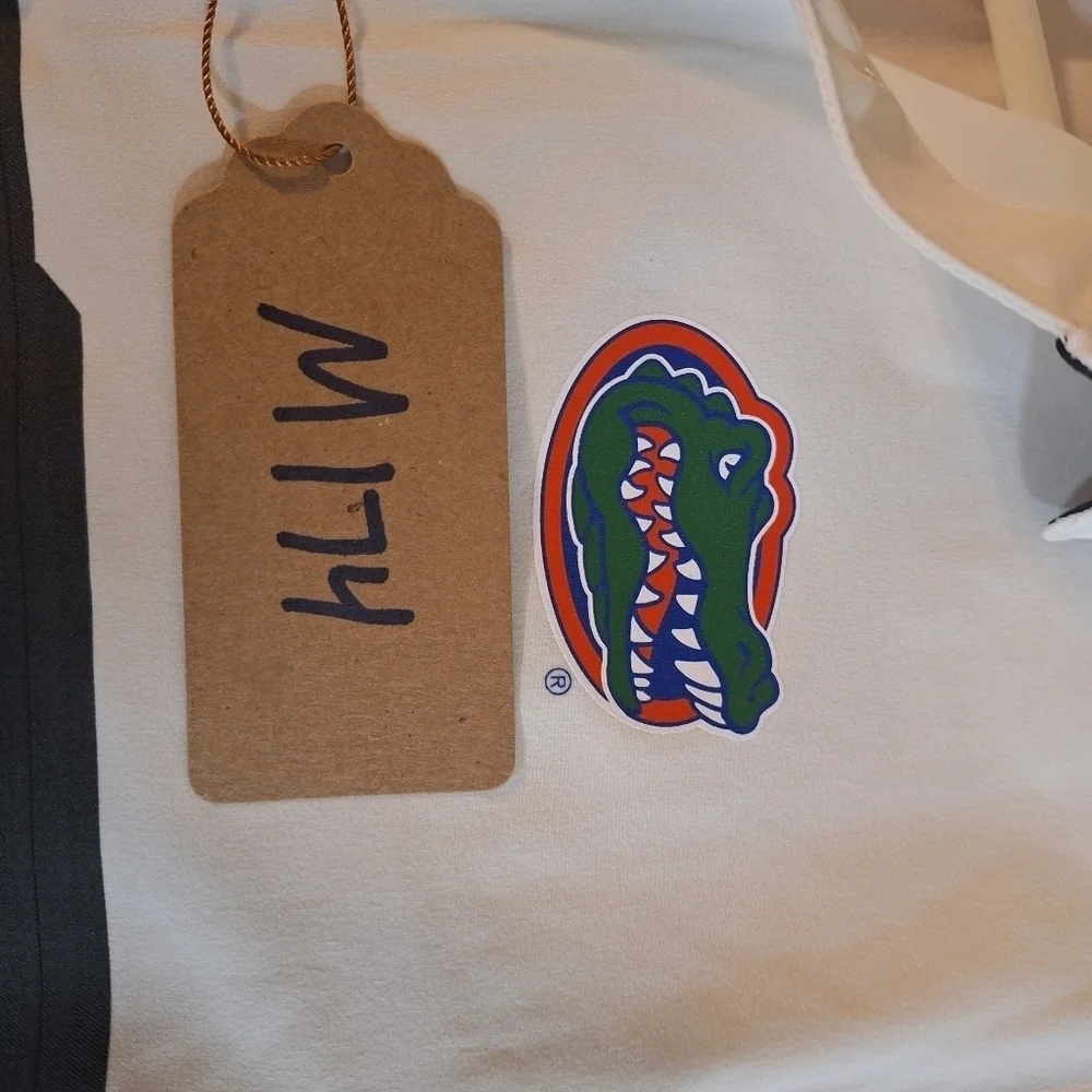 A Nike official Florida Gators short sleeve polo shirt in a men's small. NWT